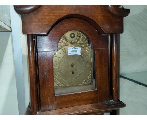 A dwarf longcase clock, the oak case with swan neck pediment and turned pillars to the hood and reeded corners to the trunk, 