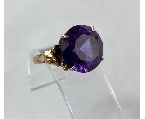 A large yellow metal amethyst set ring stamped 14k 4.3gBoth stone and ring in good condition 