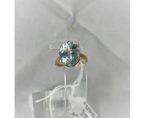 A lady's 9 carat hallmarked gold dress ring set large aquamarine coloured stone, size N.5, 4.3 g gross 