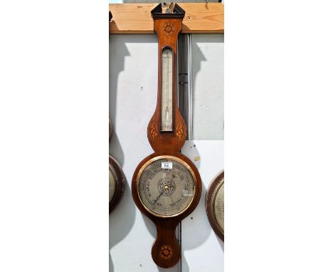 A late 19th century mercury column barometer with thermometer in mahogany banjo shaped case with Sheraton shell and flower he