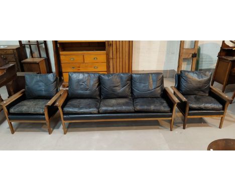 A Danish rosewood framed lounge suite comprising 3 seater settee and 2 armchairs, with black leather upholstery, length of so