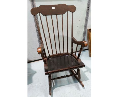 A stick back rocking chair 