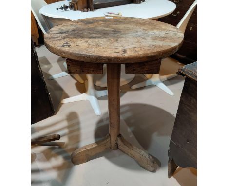 An 18th century circular elm top pedestal occasional tablegenerally quite sound, the top ink and ring stained. Height 81cm, d