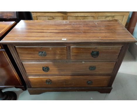An Edwardian mahogany chest of 2 long and 2 short drawers, with ring handles 