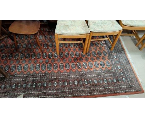 A Bokhara carpet, rust ground with 5 row of gulls to the field, 276 cm x 186 cm 
