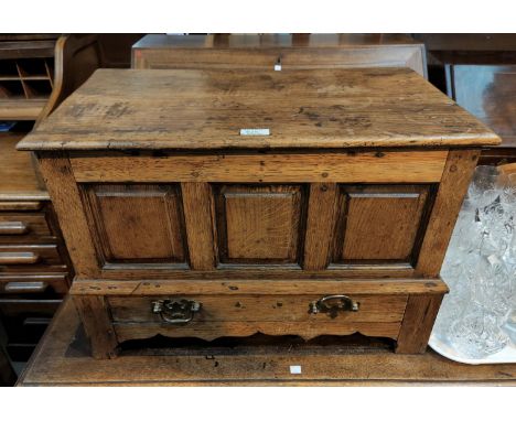 A Georgian oak framed coffer back with hinged lid, 3 fielded panels and base drawer, with shaped apron on bracket feet, width