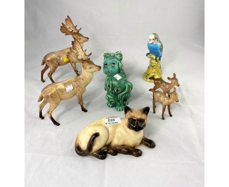 A selection of Beswick and other animal figures:  2 stags; Siamese cat, budgerigar; etc. 