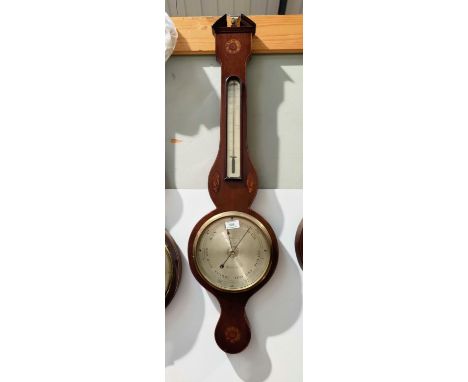 A late 19th century mercury column barometer with thermometer in mahogany banjo shaped case with Sheraton shell and floral in