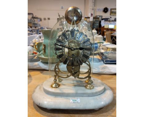 A 19th century brass skeleton clock with tripe spire, silver chapter ring and single train fusee movement with passing strike