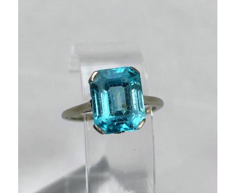 A white metal dress ring set rectangular cushion cut blue zircon, stamped '18 ct plat', 4.5 gm,&nbsp;size L / M, stone 9mm x 