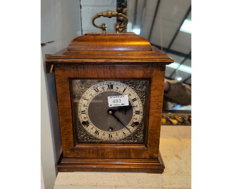 A reproduction 18th century style bracket clock in walnut caddy top case, brass dial and chiming movement, height 30cmIn good
