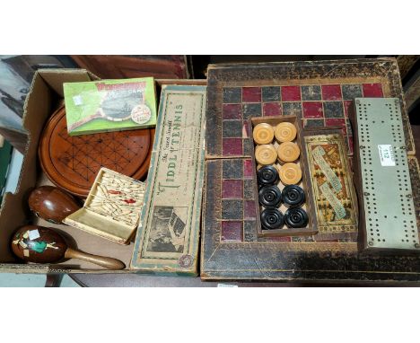 A Victorian folding backgammon board, leather covered, with a set of boxwood discs; a selection of vintage games 