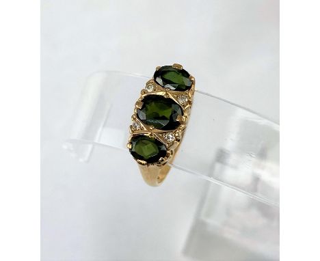 A 9 carat hallmarked gold ring set with 3 small Tourmalines and 4 small diamonds, size O/P weight 3gms