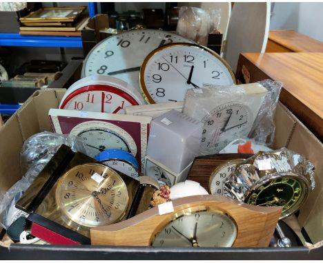 A large wall clock; other wall, alarm and mantel clocks; etc. 