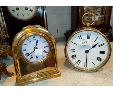 A 19th century bedside clock in circular brass case, with white enamel dial and French drum movement, diameter 13 cm; a small