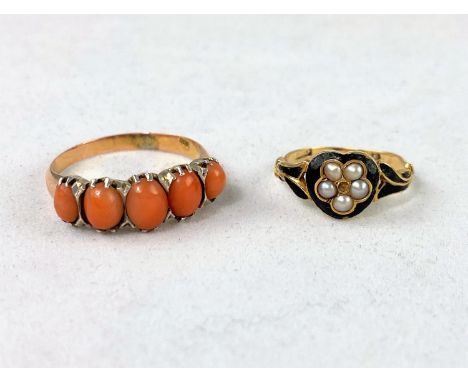 A yellow metal dress ring set 5 graduating oval coral stones, stamped '9ct', 2.7 gm; a child's yellow metal mourning ring, bl