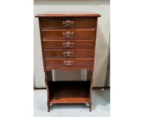 An Edwardian mahogany 5 height music cabinet with open shelf under 