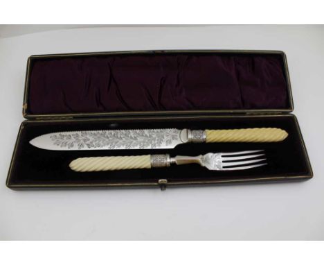 A VICTORIAN CASED SILVER PLATED CAKE KNIFE AND FORK 