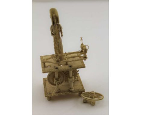 A NAPOLEONIC FRENCH PRISONER OF WAR CARVED BONE SPINNING JENNY AUTOMATON, early 19th century, 10.5cm high 