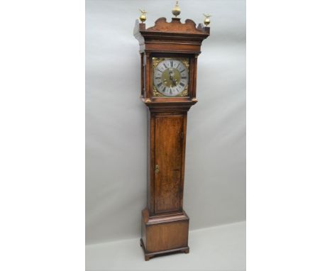 A GEORGE III OAK LONGCASE CLOCK, the brass 12" square dial engraved "Melling, Chester", cast figurative spandrels, silvered c