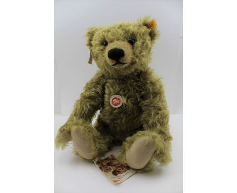 A STEIFF GERMAN CLASSIC TEDDY BEAR, blonde mohair with growler, having ear button with yellow label and other paper tags stil