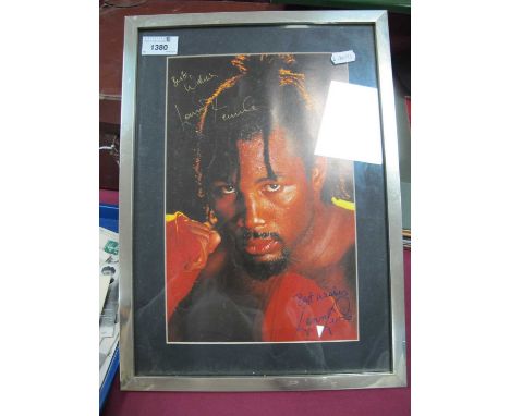 Lennox Lewis Autograph, gold pen signed (unverified) on a portrait image of him, framed, overall 38.5 x 28cm.