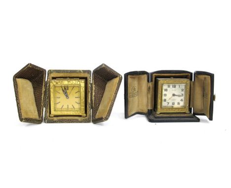 A Zenith Gilt Metal Travelling Clock, of square form with abstract design, bun feet, in faux crocodile case, 5cm high; Anothe