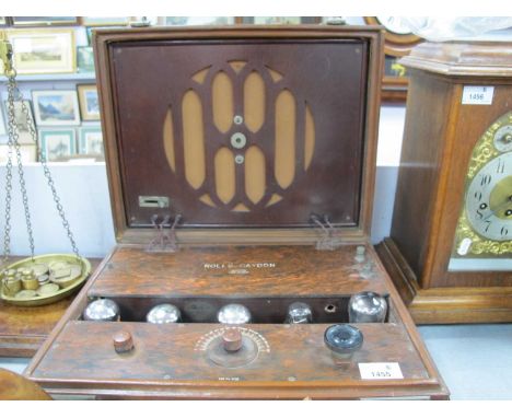 A Circa 1930's Rolls-Caydon Radio, in leather case, five silver coloured valves showing in bakelite surround below inset spea