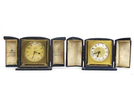 A Zenith Gilt Metal Travelling Clock, of square form, retailed by Geo Jamieson and Son, Aberdeen, leather case, 5.5cm high; A