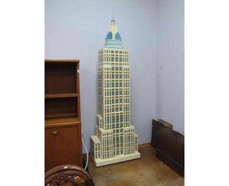 Floor Standing Bookcase/Storage Cabinet as The Empire State Building, circa 1990's in cream and blue, with a lift up top secr