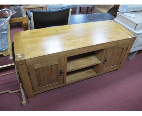 J.B. Global Oak Rectangular Shaped TV Cabinet, with central shelf flanking cupboard doors, 136cm wide.