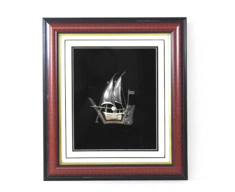 A silver model of a junk ship, in a display frame, 43 x 39cm