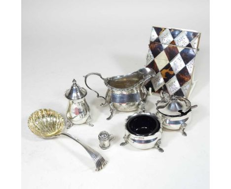 An early 20th century silver three piece condiment set, Birmingham 1969, together with a silver cream jug, Sheffield 1900, a 