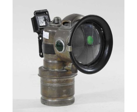 An early 20th century Miller patent cycle lamp, 18cm highLens is cracked
