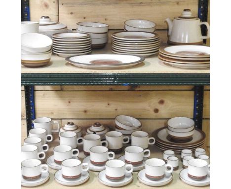 An extensive Denby cream glazed tea and dinner service, with brown borders
