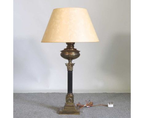 A brass column table lamp and shade, 91cm high