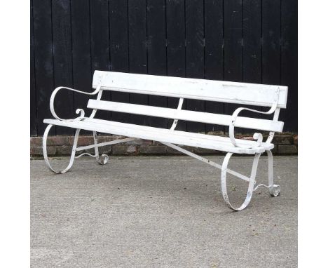 A white painted slatted wooden garden bench, on metal supports, 183cm wide
