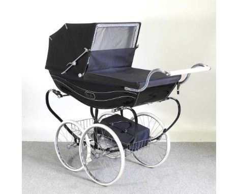  A Silver Cross pram, with a black canvas cover, 131cm long and a matching bag