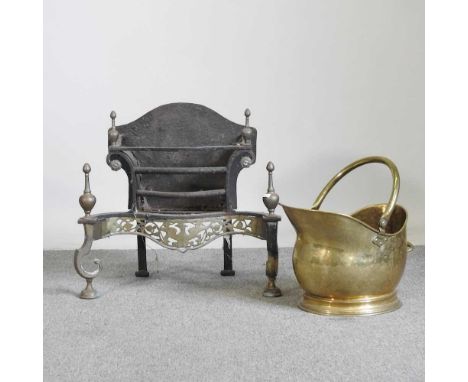 A 19th century brass and iron fire grate, with pierced decoration, 56cm wide, together with a Victorian brass coal scuttle (2