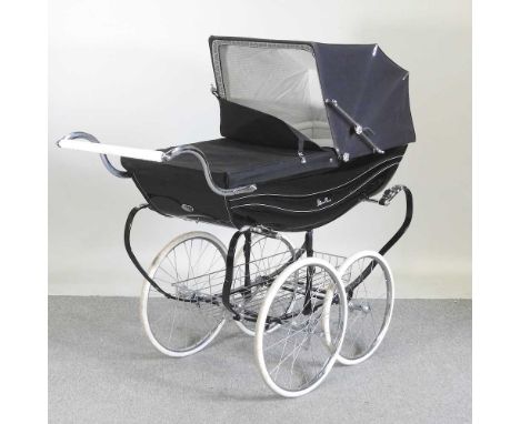 A Silver Cross pram, in black canvas, with a hood and cover, 127cm long