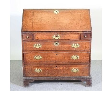 An 18th century oak bureau, with a fitted interior, on bracket feet90w x 52d x 103h cm