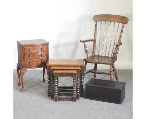 An early 20th century stick back open armchair, together with a nest of three oak occasional tables, an oak box and a walnut 
