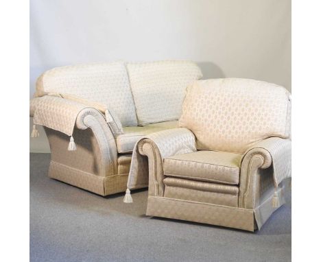 A modern gold upholstered two seater sofa, together with a matching armchair, by Rhodabourne upholstery (2)192w x 90d x 88h c