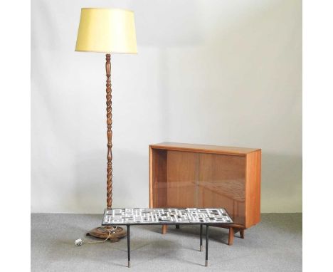 A 1960's glazed bookcase, 91cm wide, together with a wooden standard lamp and a tile top coffee table (3)