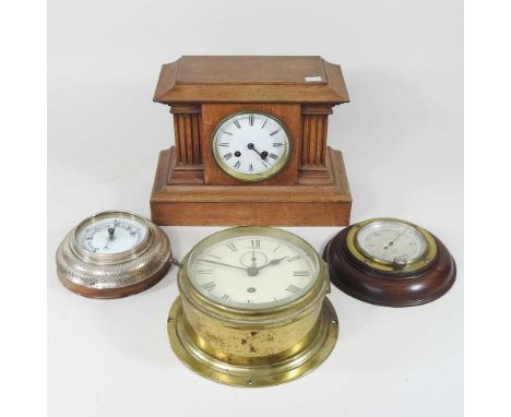 An early 20th century oak cased mantel clock, 21cm high, together with a silver cased aneroid barometer, a brass cased ship's
