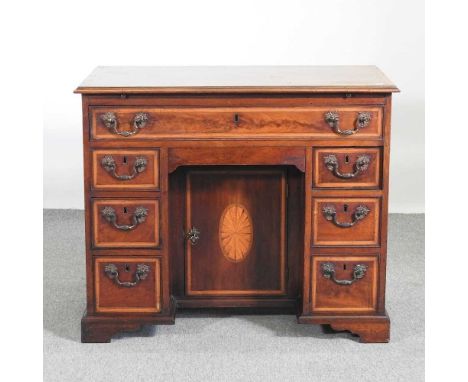 A 19th century mahogany, inlaid and crossbanded kneehole desk, on bracket feet91w x 53d x 77h cm