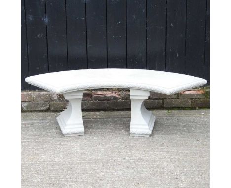 A cast stone curved garden bench128w x 50d x 40h cm