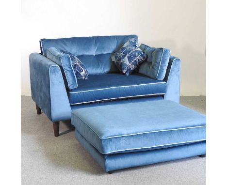 A Sofology blue upholstered sofa, with loose cushions, together with a matching footstool (2)136w x 97d x 70h cmThe label is 