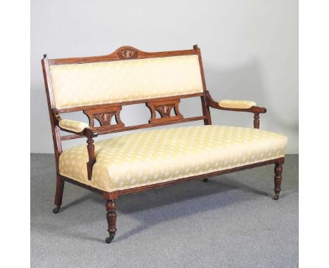 An Edwardian walnut yellow upholstered show frame sofa, on turned legs127w x 70d x 87h cm
