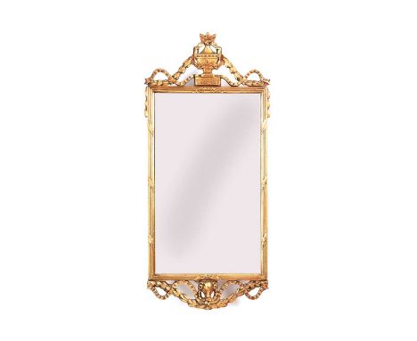EDWARDIAN GILT WALL MIRROR WITH SWAGS SURMOUNT AND RAMS HEAD TO BASE.HEIGHT: 36 INCHES.WIDTH: 15 INCHES.IN GOOD CONDITION.